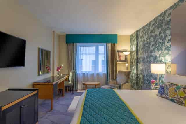 Hotel room with workspace for business travelers, mid-tier travel accommodation, club lounge.