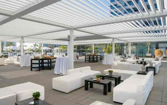 Glasshouse outdoor terrace at Hilton Barcelona for corporate networking reception and events.