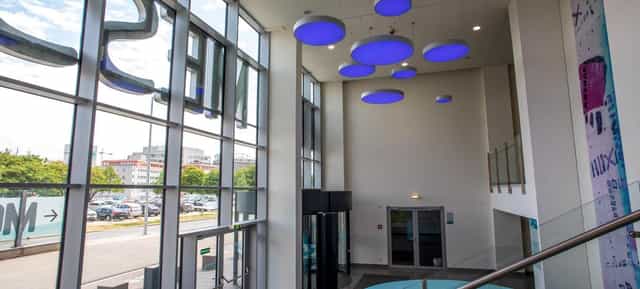 Modern MGC Messe venue foyer for professional networking and corporate event registration.