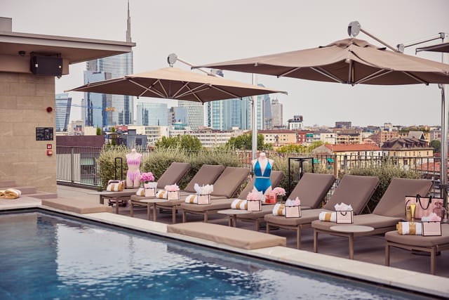 The VIU Terrace rooftop event setup with branded decor and Milan skyline view for luxury launches.