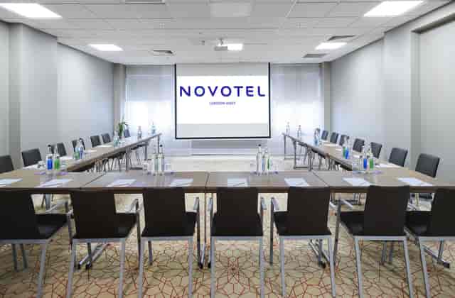 Corporate meeting room at Novotel London West with U-shaped table setup.