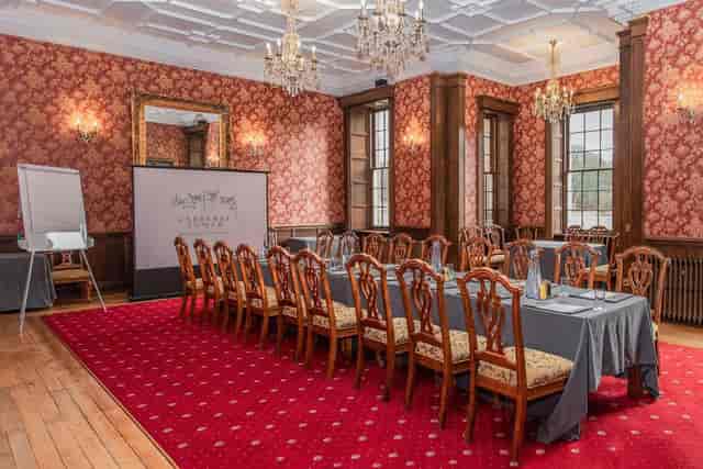 Boardroom setup in Carberry Tower heritage mansion for corporate meetings and event hire.