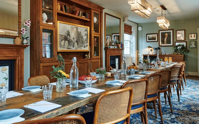 Luxury library boardroom at Farnham Castle for executive meetings and private dining.