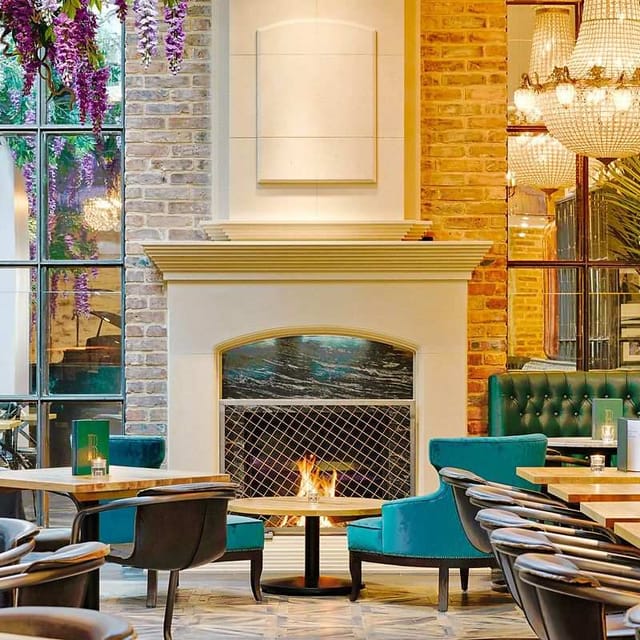 Luxury Black Ivy lounge with statement fireplace for executive retreats and networking events.