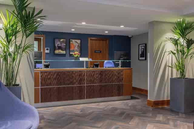 Upscale hotel reception lounge for professional delegate check-in and event registration.