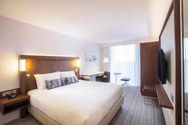 Modern hotel conference room with desk area for business meetings and corporate event bookings.
