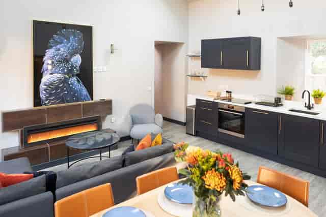 Courtyard Dining Room with fireplace for luxury VIP retreats and corporate board meetings.