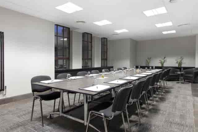 St Andrews Suite boardroom setup with ergonomic seating for professional meetings and events.