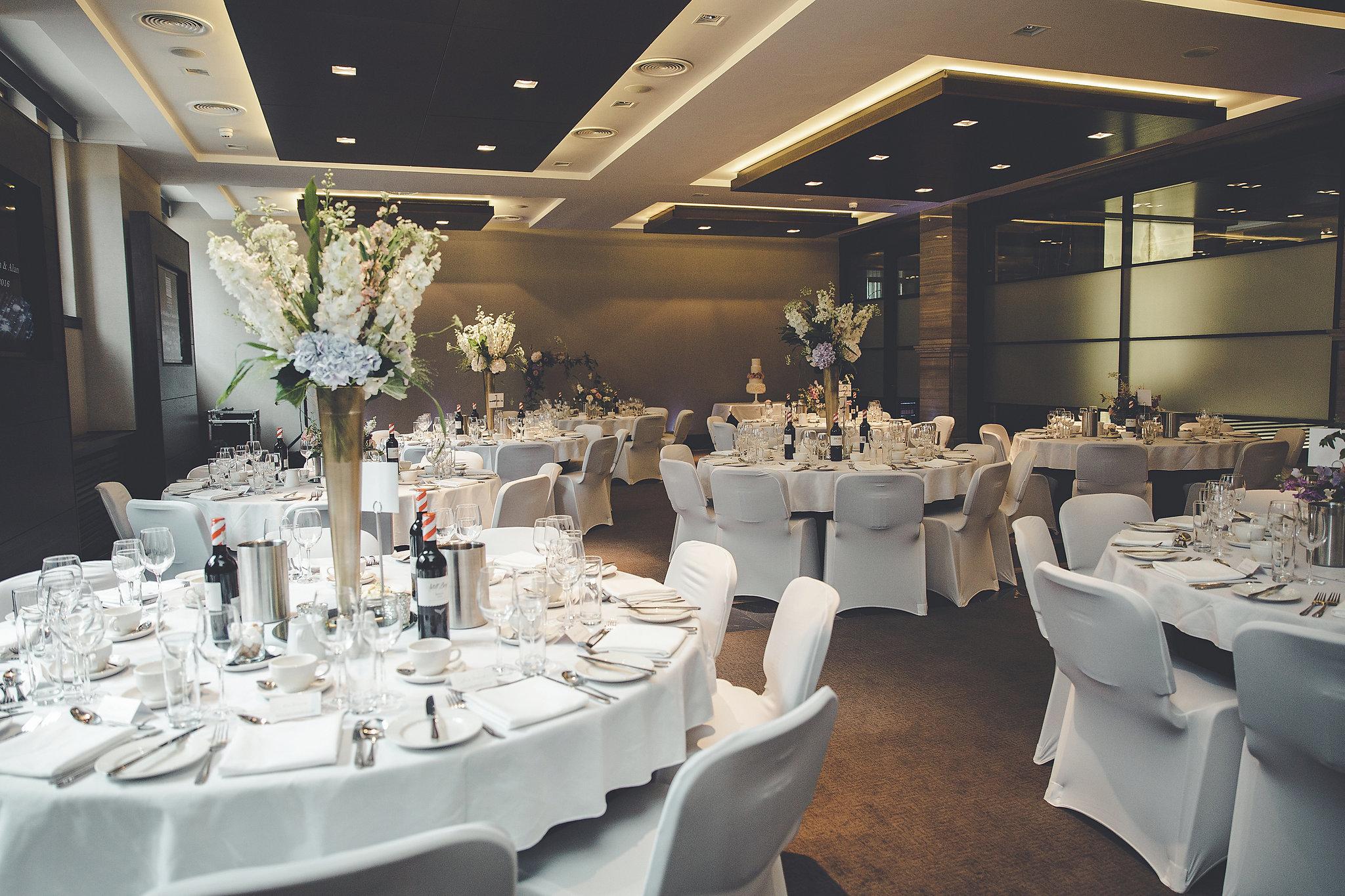 Glasgow Suite banquet ballroom with floral centerpieces for wedding reception or formal gala. - Banner