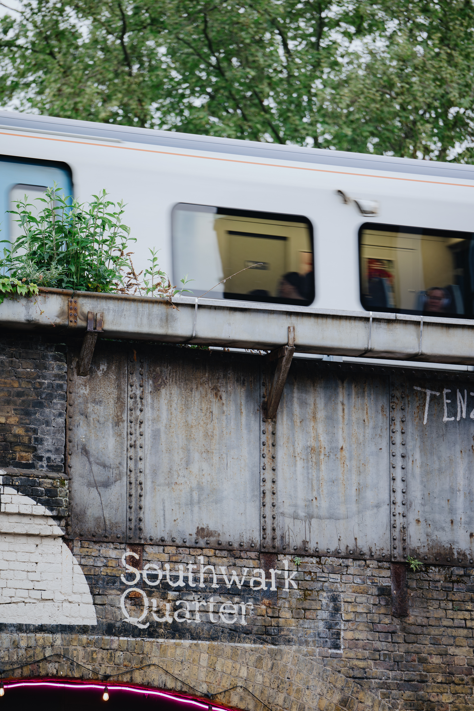 Urban Pyro Terrace with a train overhead, perfect for city-themed events and networking. - Banner