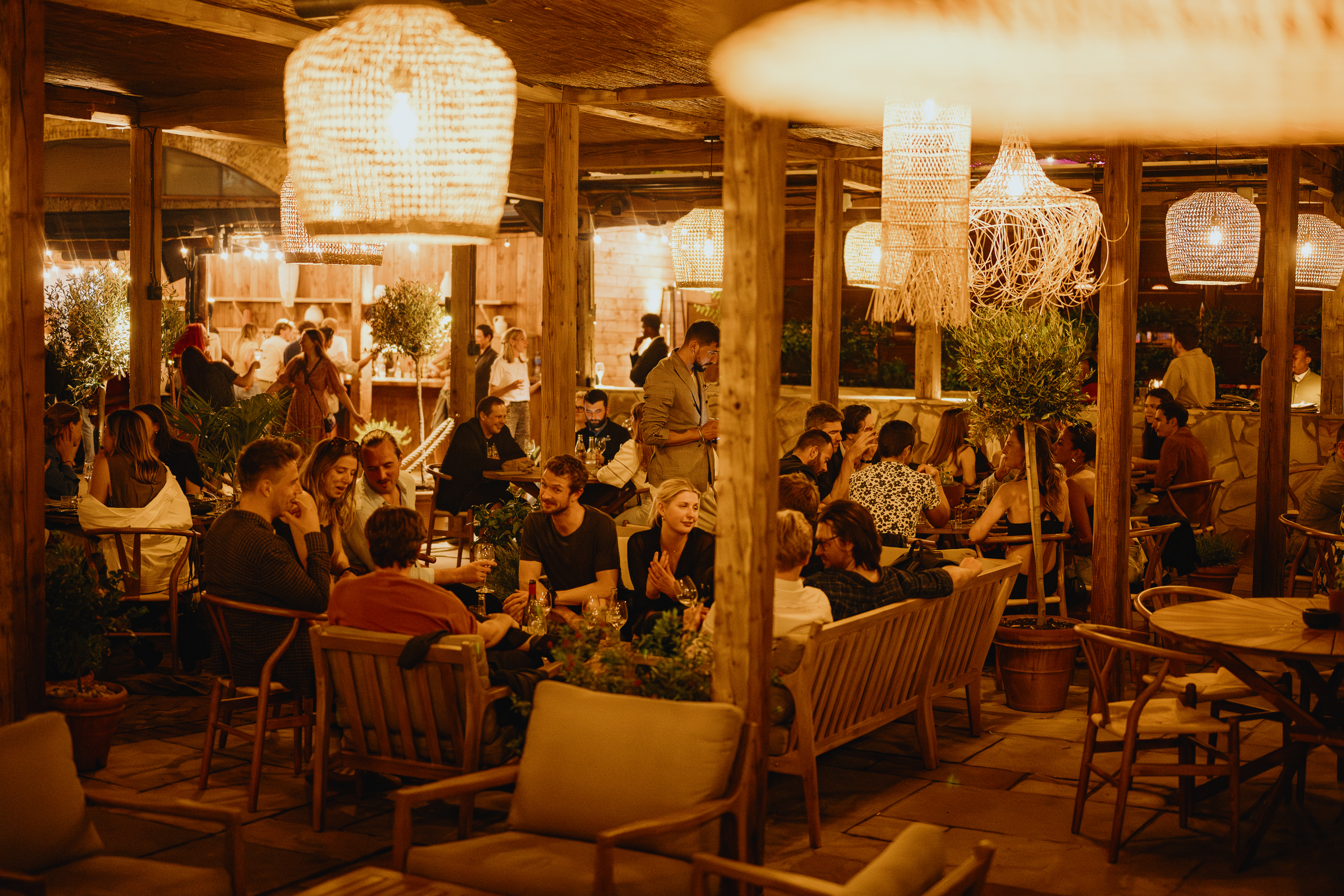 Vibrant Pyro Terrace event space with warm lighting for social gatherings and networking. - Banner