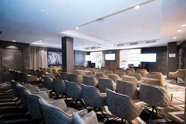 Modern tiered theater for corporate conference or executive presentation at At Edith's, Paris.