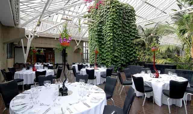 Barbican Conservatory event, lush greenery, banquet, reception