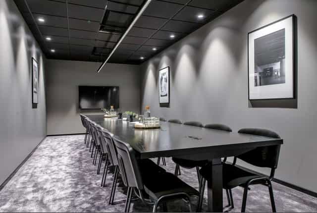 Modern boardroom at Fleminggatan 18 with integrated tech for high-stakes corporate meetings.