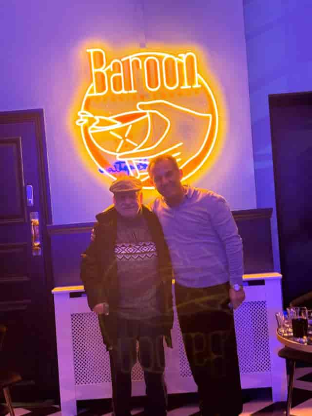 Neon Baroon Lounge sign for breakfast reservation, ideal for social media event photography.