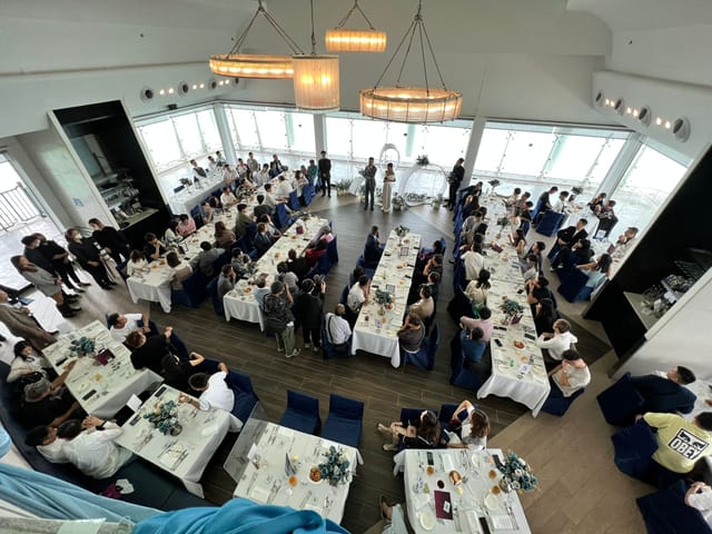 Wedding reception at Watermark Hong Kong featuring elegant long-table dining setup.