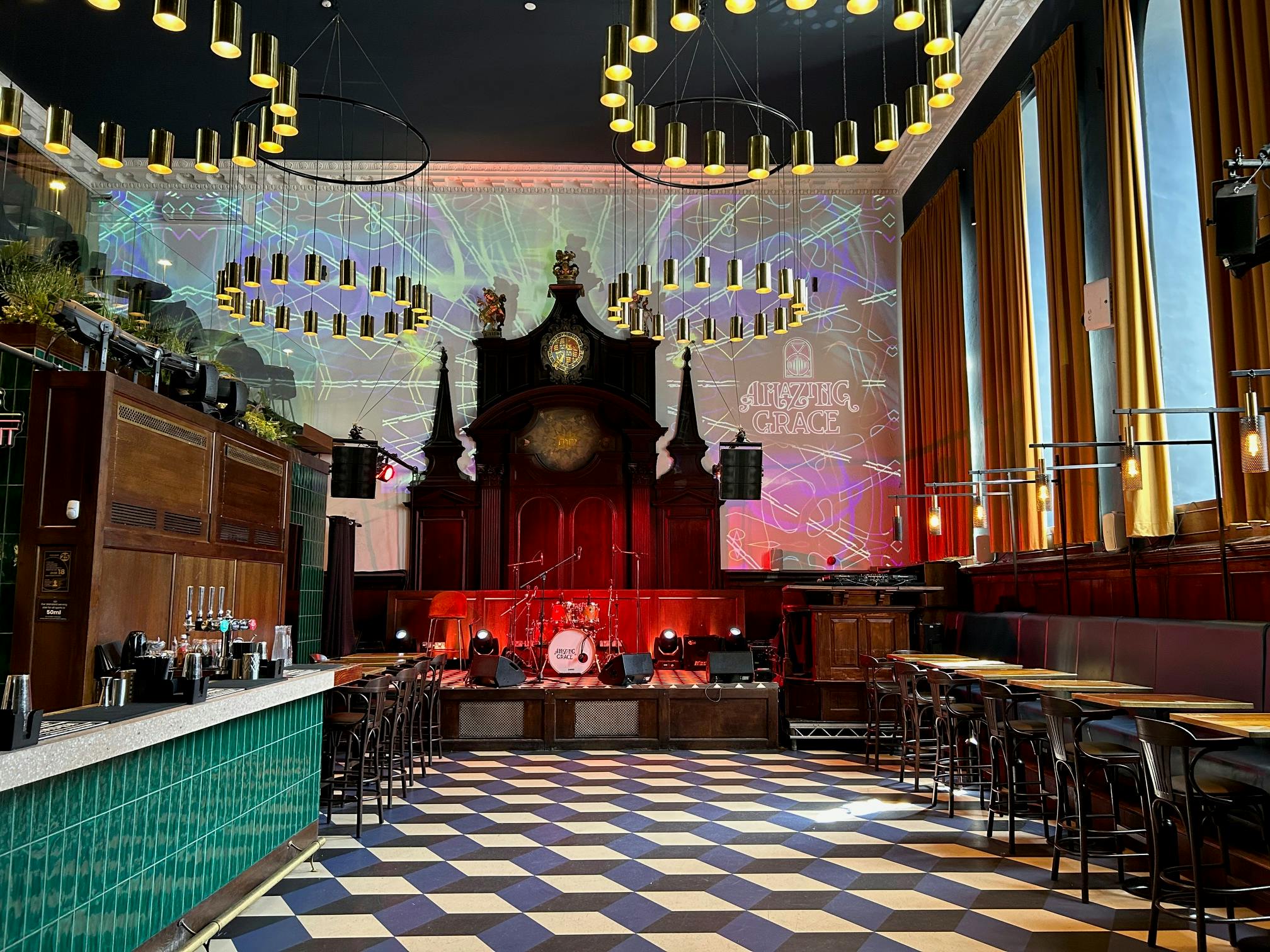 Versatile event space with stylish bar, ideal for corporate events and social gatherings.