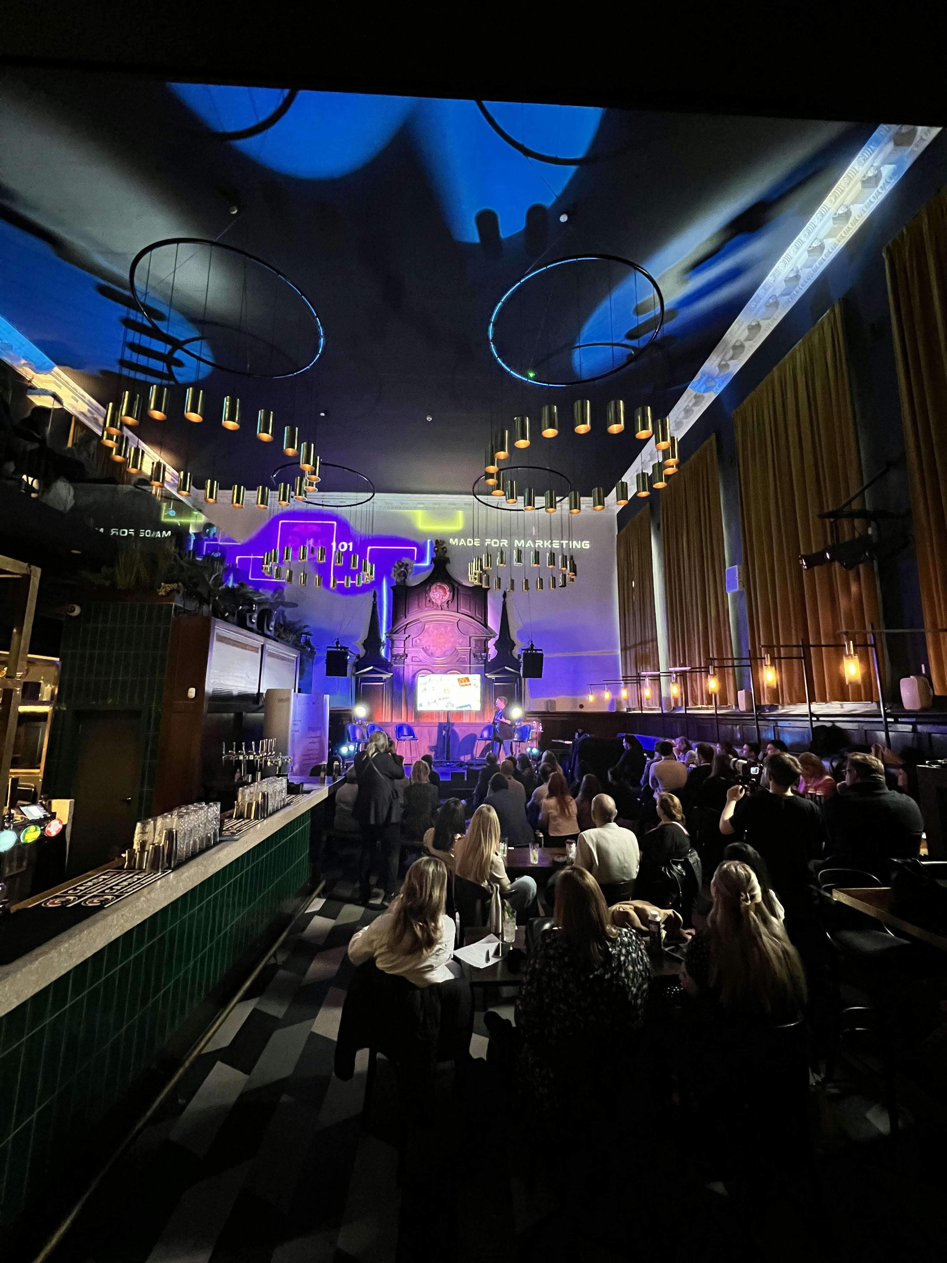 Vibrant event space with stylish bar, ideal for networking and product launches.