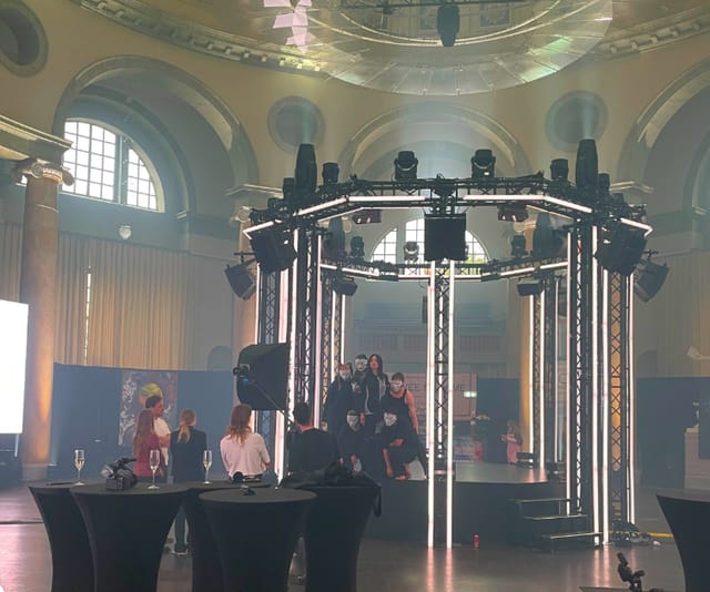 Circular LED stage lighting at a historic Skeppsholmen concert venue for theatrical performance.