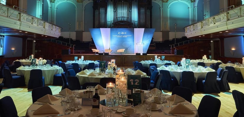 Gala dinner at Thrive Event Hall with professional stage and lighting for corporate networking.