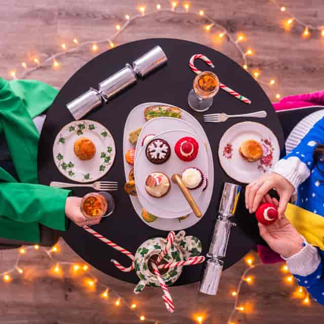 Brigit’s Afternoon Tea Bus: Festive holiday table setting for social events and tea parties.
