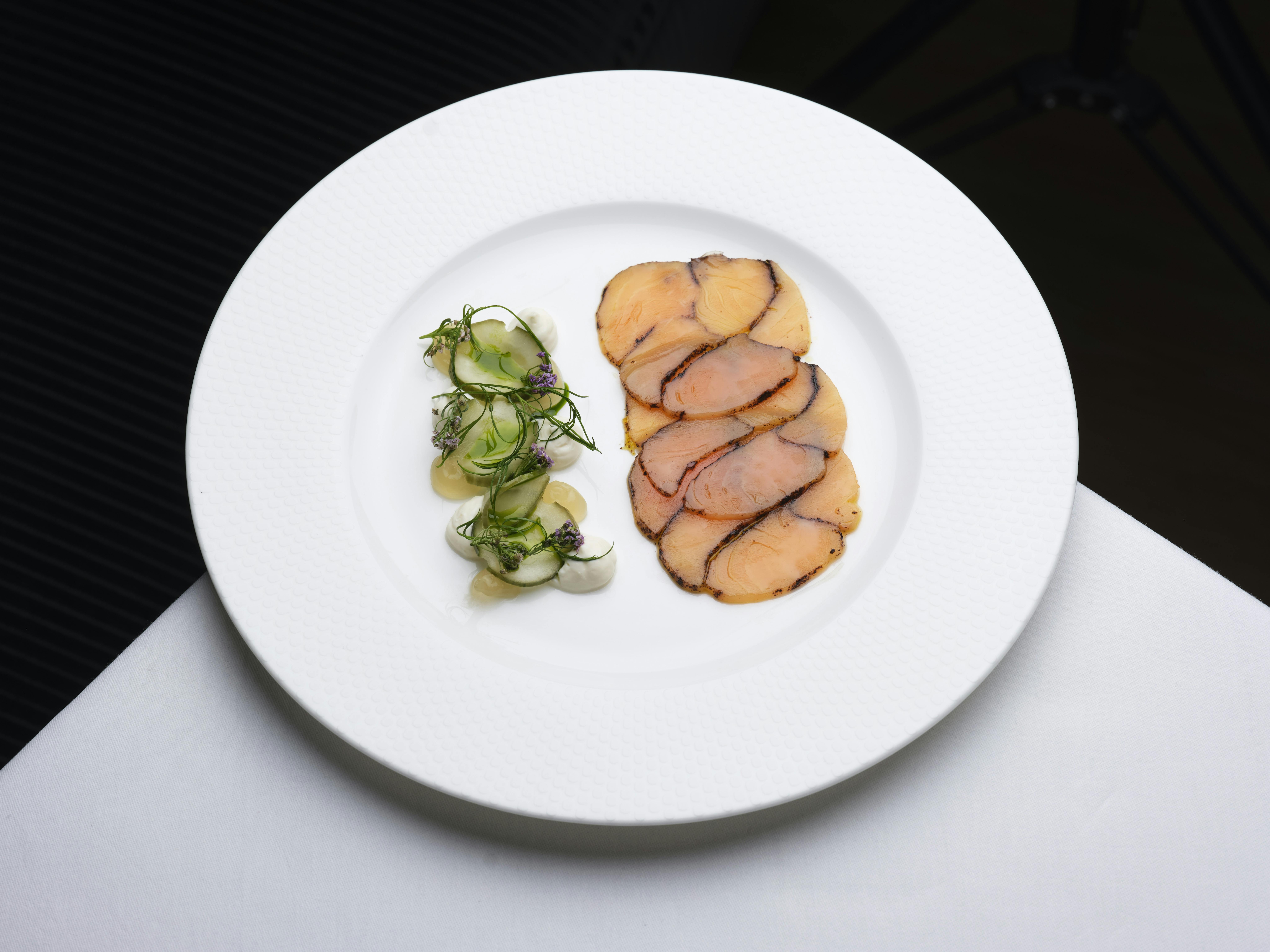 Elegant plated dish with protein and salad at Bechstein Hall for fine dining events.
