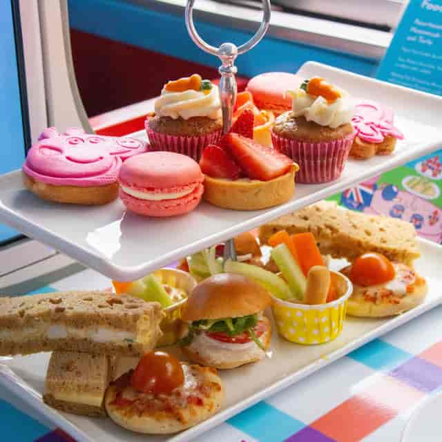 Peppa Pig themed afternoon tea bus in London for kid-friendly corporate events and family parties.