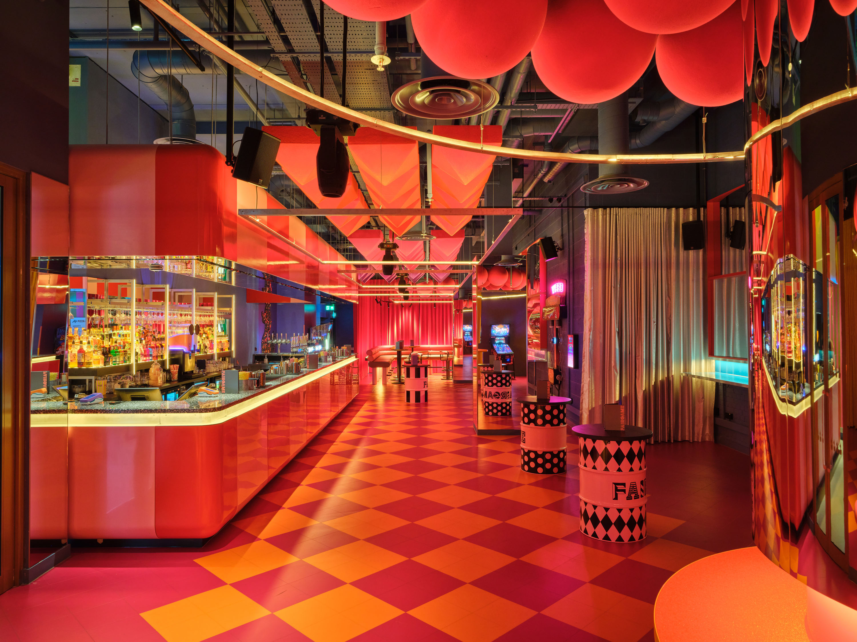 Vibrant bar area in The Fun House at FAIRGAME, perfect for events and gatherings. - Banner