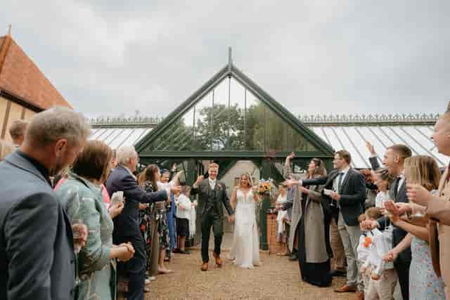 Wedding recessional at Waddesdon Winter Garden featuring iconic architecture for luxury events.