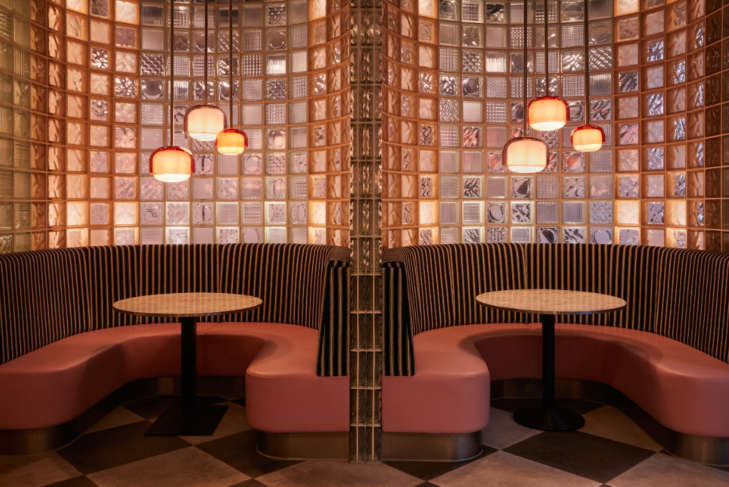 Stylish modern seating in The Lounge & Kebab Queen, perfect for networking events. - Banner