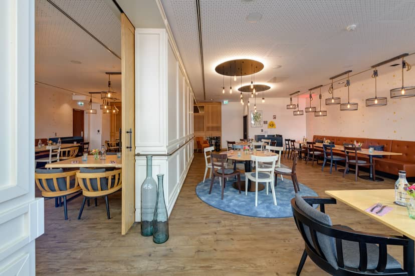 Modern private dining room at Hotel Mondial am Dom for corporate events and intimate meetings.