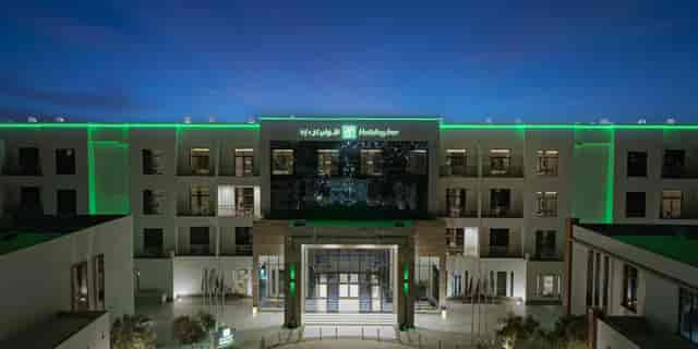 Modern Holiday Inn Riyadh exterior at dusk, ideal for corporate events and business conferences.