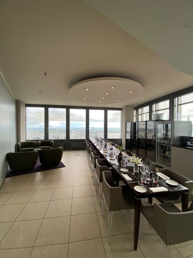 Elegant meeting space with panoramic windows for executive meetings and exclusive events.