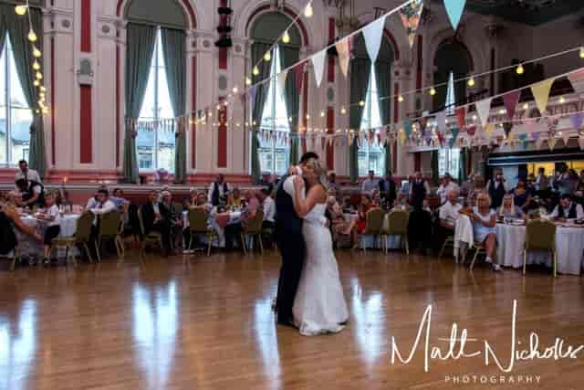 Victoria Hall wedding reception with bistro lighting and dance floor.