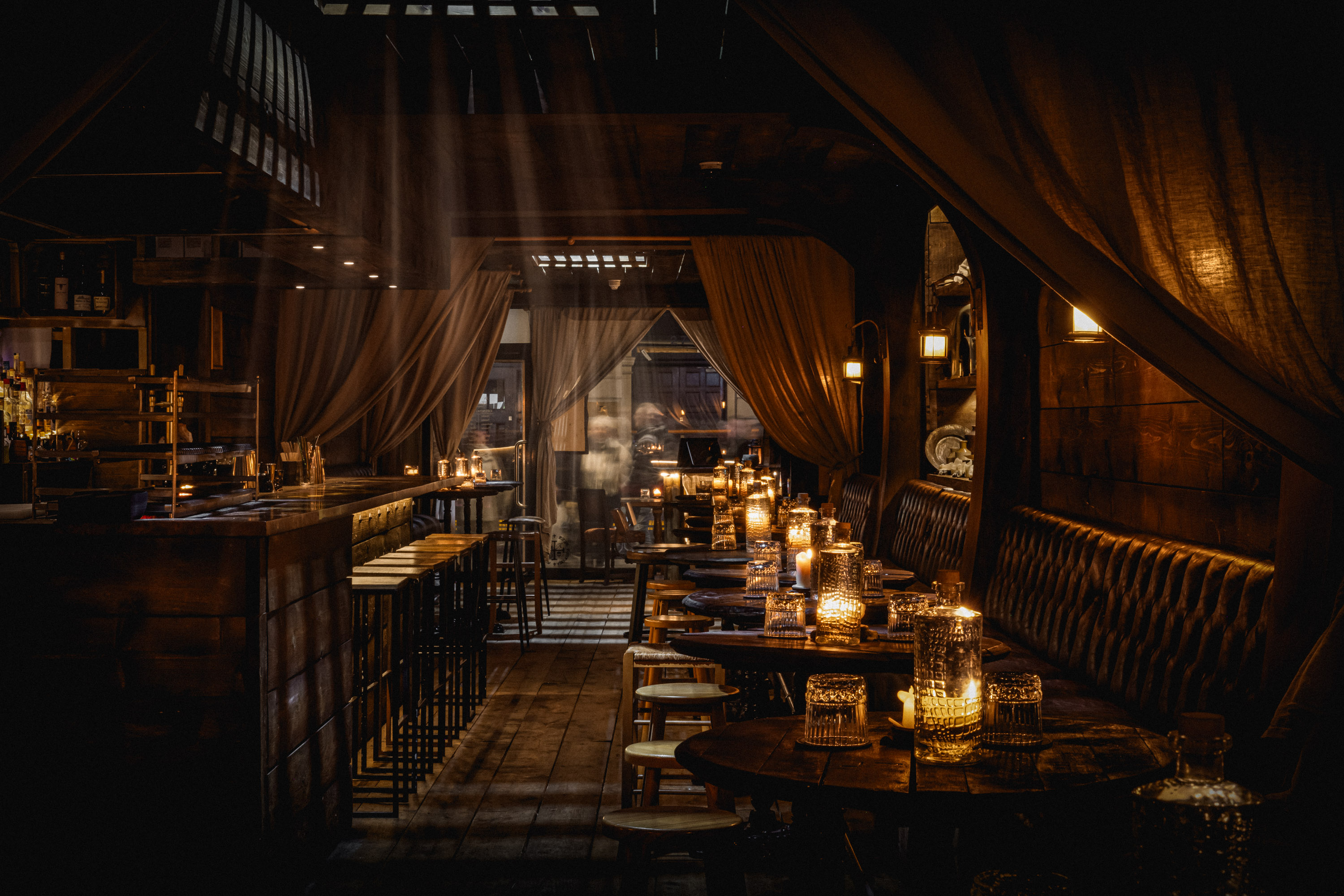 Rhum Tavern cocktail bar with moody lighting for VIP receptions and networking events. - Banner