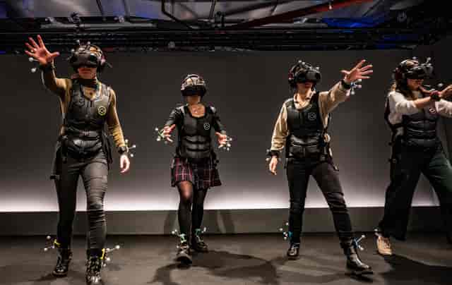 Full-body VR motion capture for immersive team building activities at Sandbox VR.