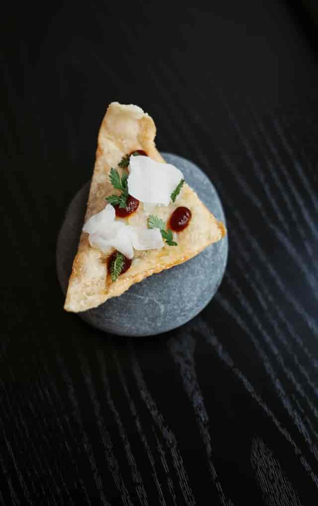 Gourmet hors d'oeuvre with creative plating for upscale reception or corporate event catering.