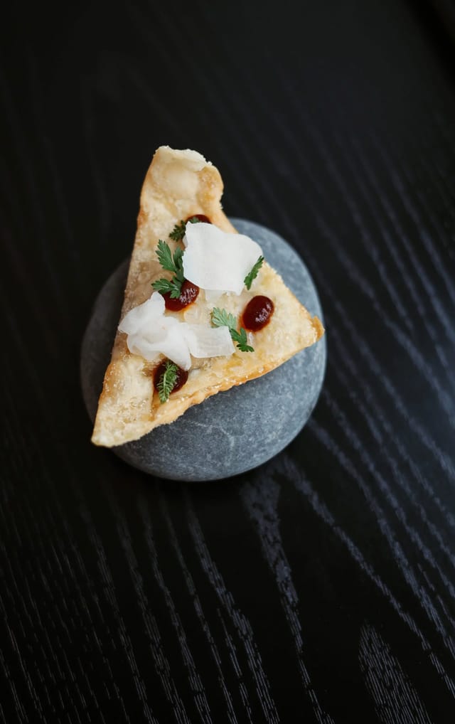 Gourmet hors d'oeuvre with creative plating for upscale reception or corporate event catering.