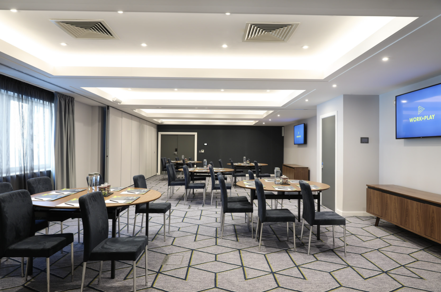 Modern cabaret-style breakout room at Malmaison Brighton for workshops and corporate meetings. - Banner