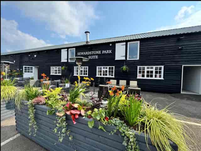 Rustic Sewardstone Park Suite event space with outdoor terrace for corporate retreats and meetings.
