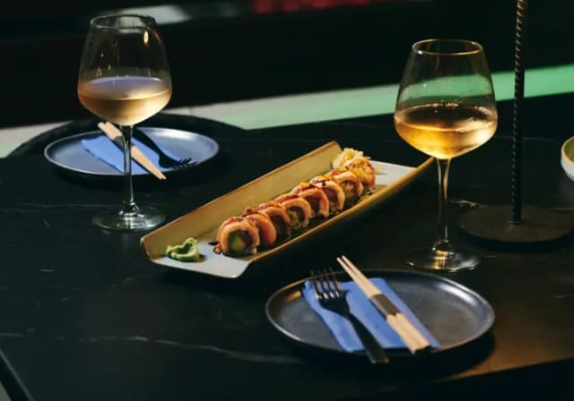 Intimate sushi and wine networking reception at Above, ideal for sophisticated business events.