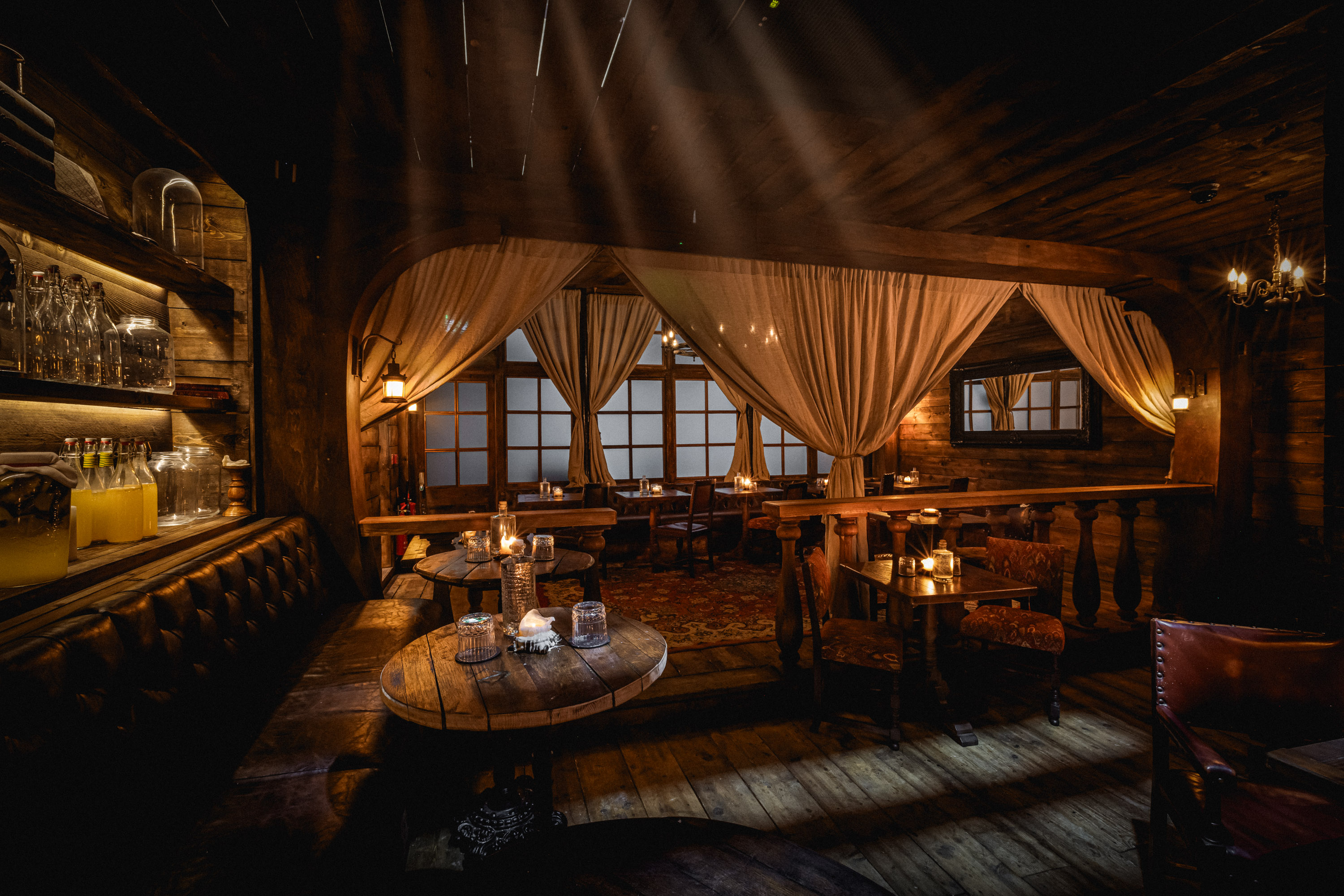 Captain’s Quarters VIP dinner at Rhum Tavern with warm wood decor for exclusive networking events. - Banner