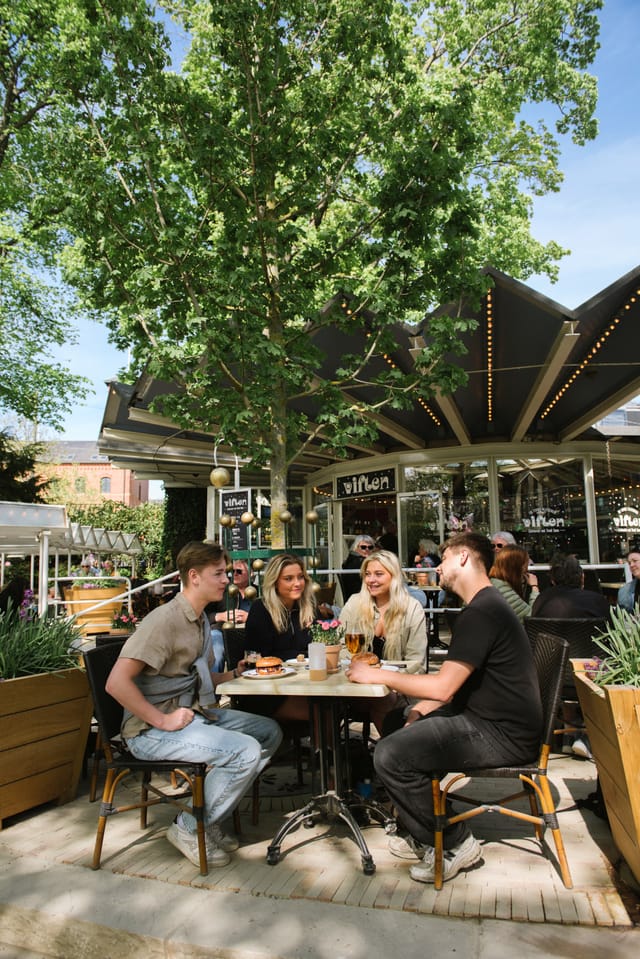 Restaurant KILDEN: Open-air garden seating for corporate networking and event social mixers.