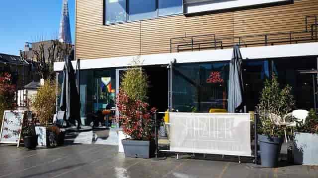 Modern cafe bar with outdoor patio for networking and social events at The Arzner.