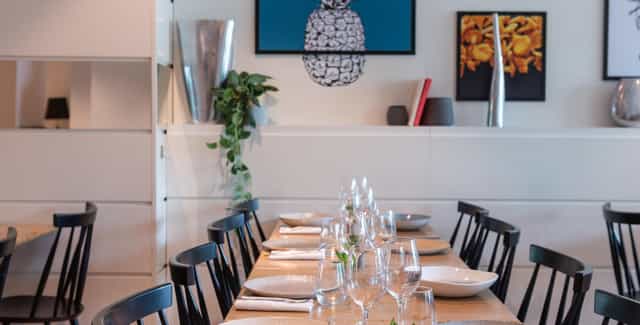 Le Dix Restaurant: Elegant table setup for corporate board dinners and networking events.