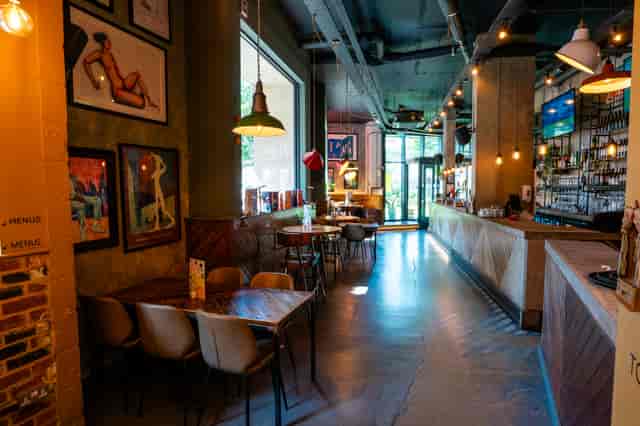 Industrial-chic bar area at Leadbelly's, ideal for networking mixers and corporate happy hours.
