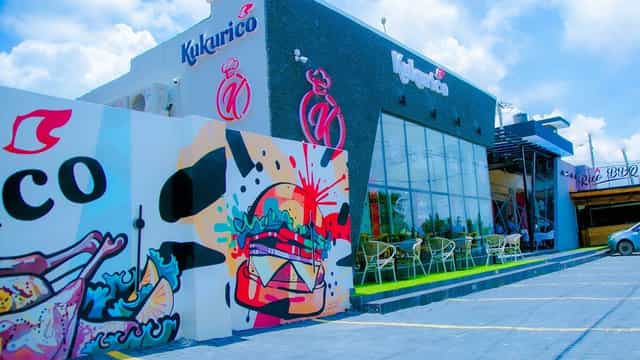 Modern Kukurico restaurant interior with mural walls, perfect for networking events and activations.