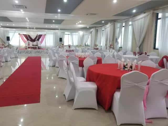 Masiani Hall banquet room with red-carpet aisle for gala and wedding event venue.