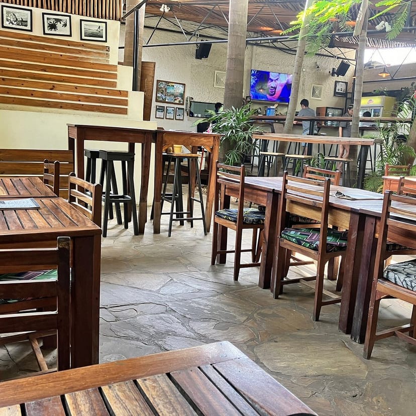 Casual restaurant venue with high-top seating, perfect for networking events and breakout sessions.