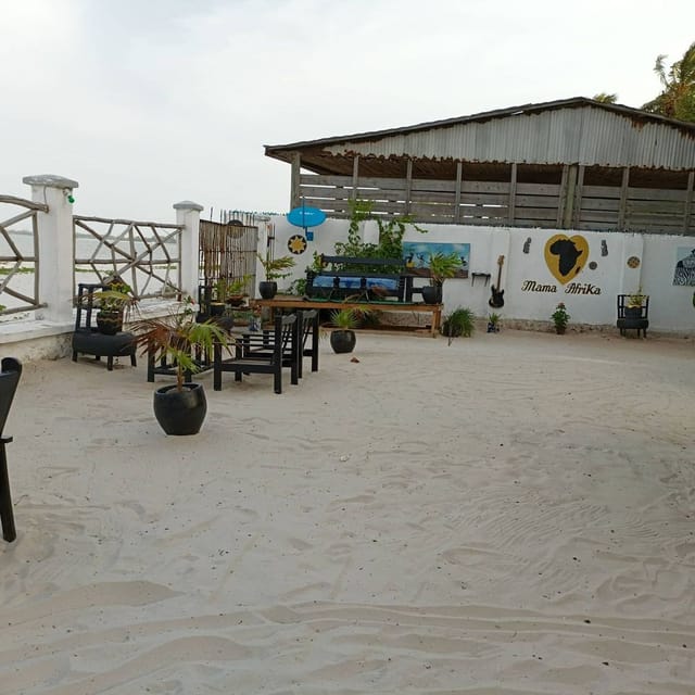 Rustic outdoor restaurant with sand floor, perfect for networking mixers and cocktail receptions.